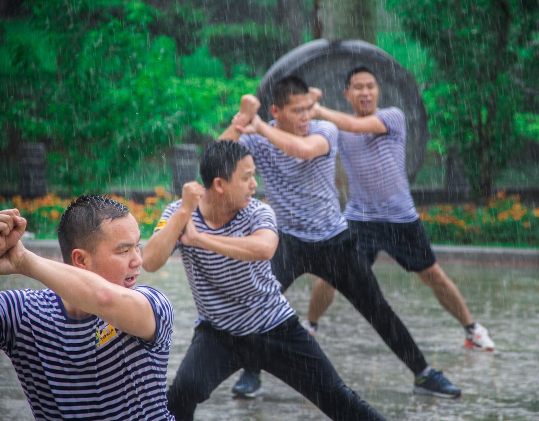 2-boys-playing-on-water-fountain-during-daytime-zdk-abtkpjs
