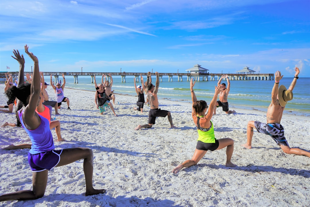 Yoga Workout On The Beach With Group